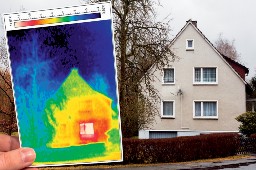 Photo of a house with a thermal image of the same house in the foreground.