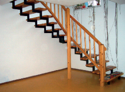Photo of a staircase out of the basement.